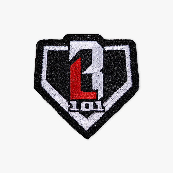 Adult model wearing multi-color patch with "BL101 Plate Patch" design