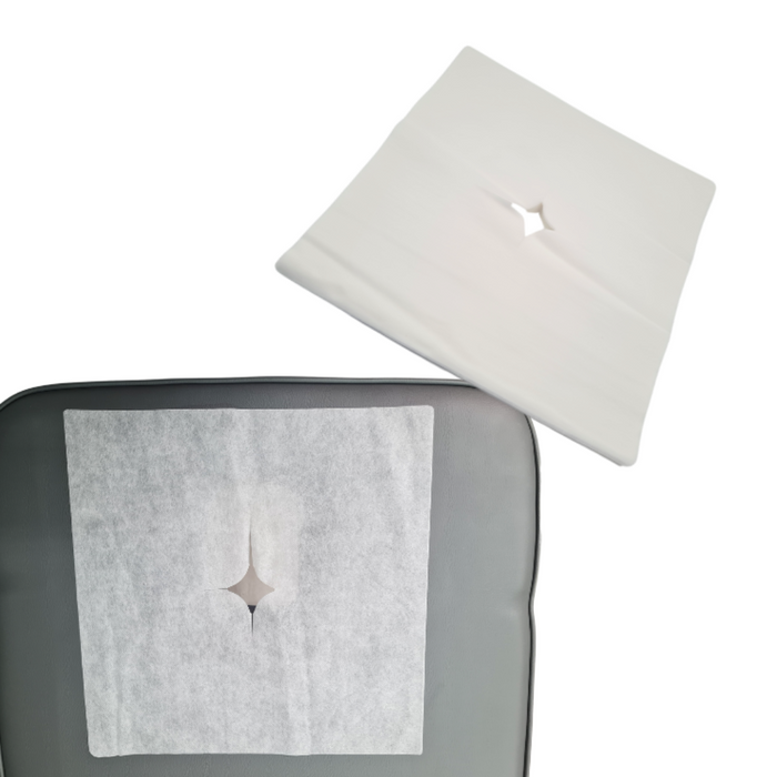 Z737 Leonelda Breathing Hole Cover 100's | A white non-woven square with placed over breathing hole of grey and wooden massage bed with close up of non-woven square fabric in top right corner