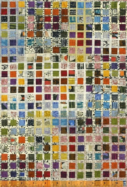 A multicolored block-printed cotton fabric displayed alongside a ruler for scale.
