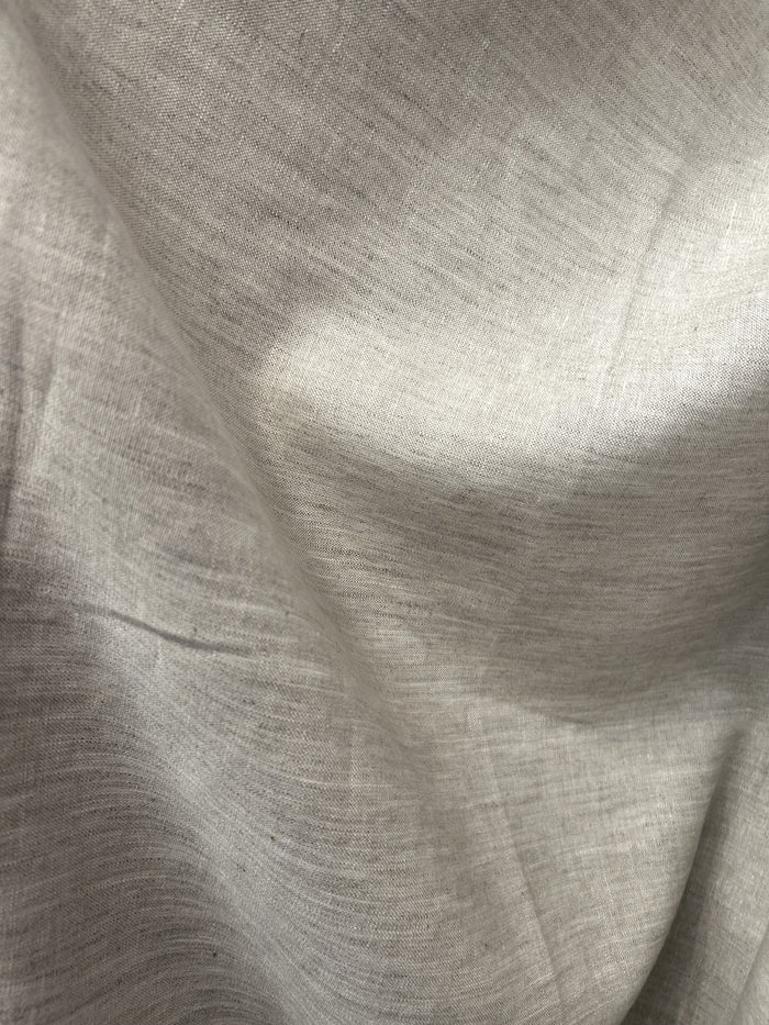 neutral medium-weight linen in a calming almond beige color draped.