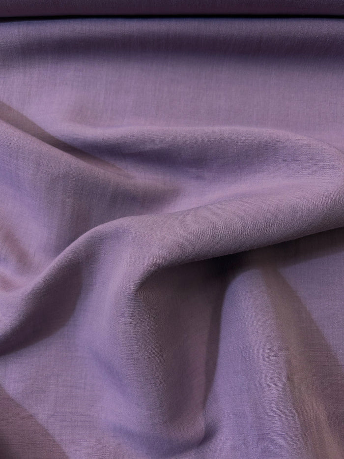 draped linen in a stunning mauve purple color made in Italy .