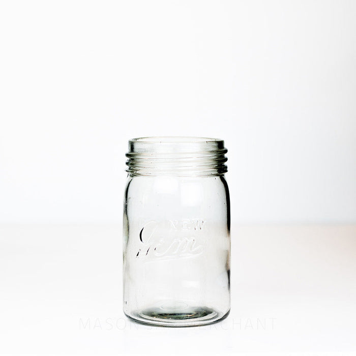 Vintage gem mouth pint mason jar with New Gem logo against a white background