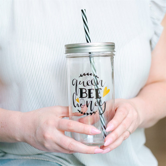 Photo of a mason jar tumbler with a text that says "Queen bee honey"