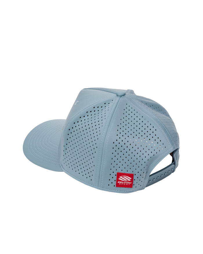 Light blue perforated baseball cap with adjustable snapback and small red brand label on rear