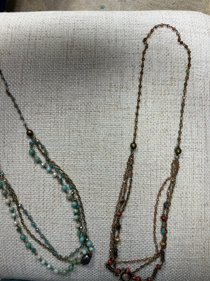 Beaded 2-in-1 necklace from American Unique Group featuring colorful beads and layered design.