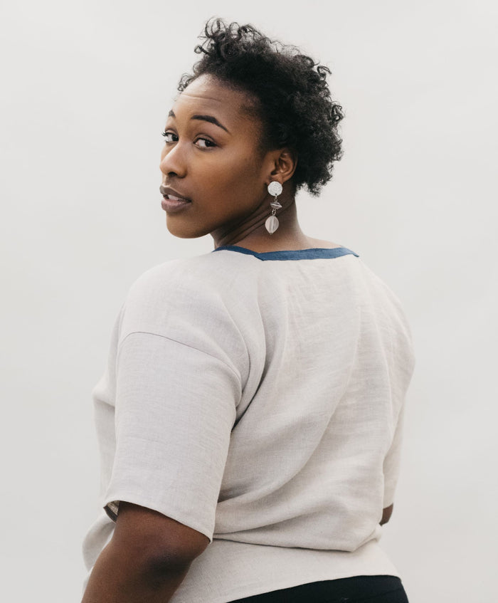 Back view of African american women looking over her shoulder wearing the 211 Two middies.