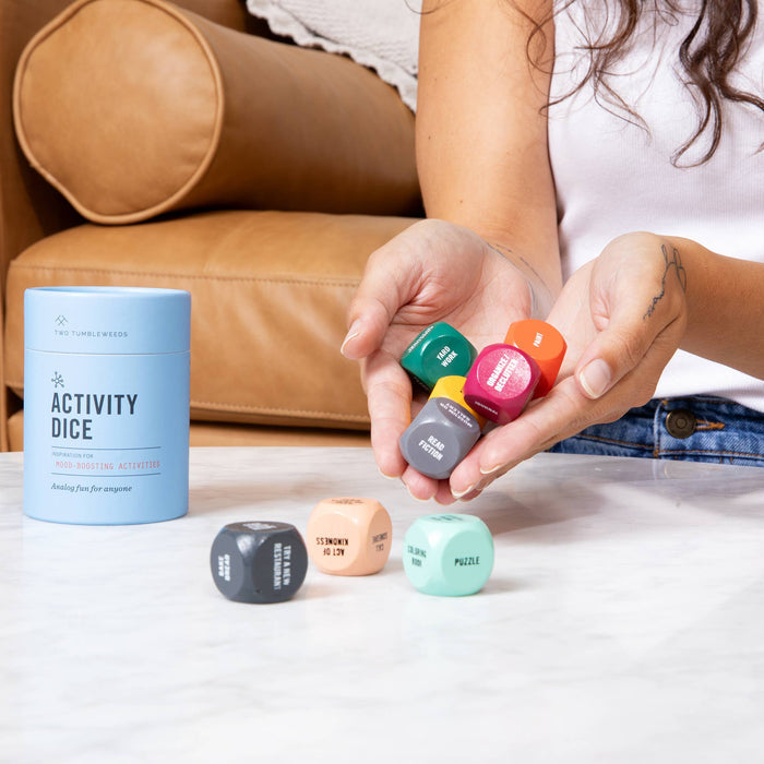 Two Tumbleweeds Activity Dice set showing colorful cards and game components for interactive fun and learning.