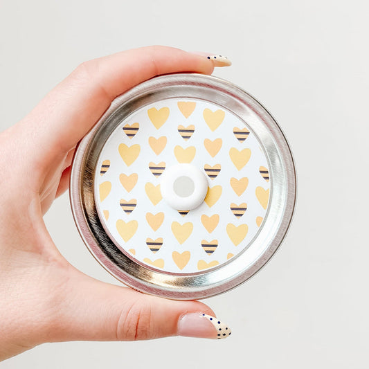 top photo of mason jar lid with a heart colored like a bee And yellow heart