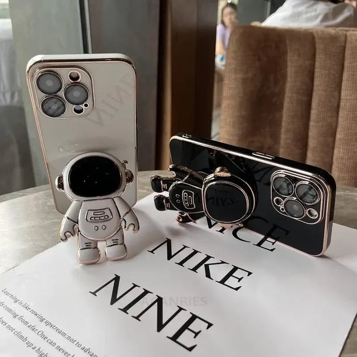 a phone case with a small astronaut figure on it