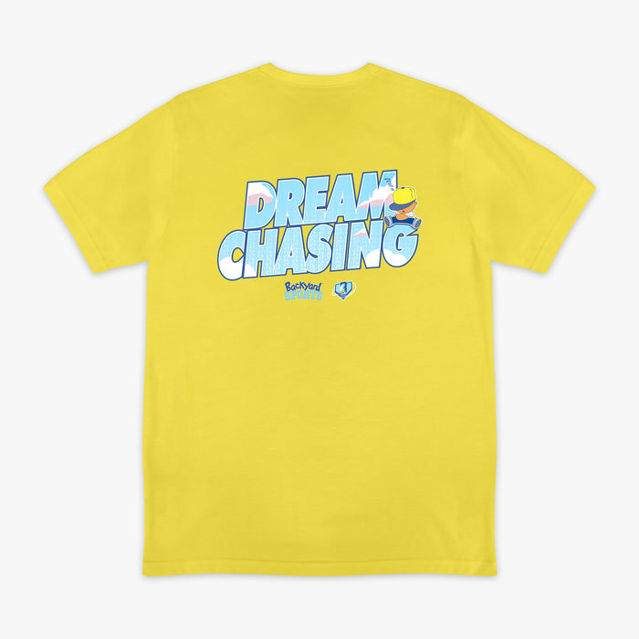 Yellow t-shirt with 'Dream Chasing' text and Pablo Sanchez design on a white background