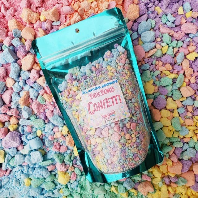 Colorful Roxy Grace Bath Bomb Confetti with vibrant, mixed-hued bath bombs and confetti pieces in a relaxing spa setting