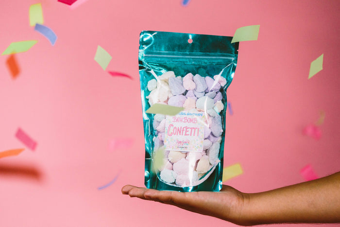 Colorful Roxy Grace bath bomb confetti with vibrant, swirling hues perfect for relaxing bath time.