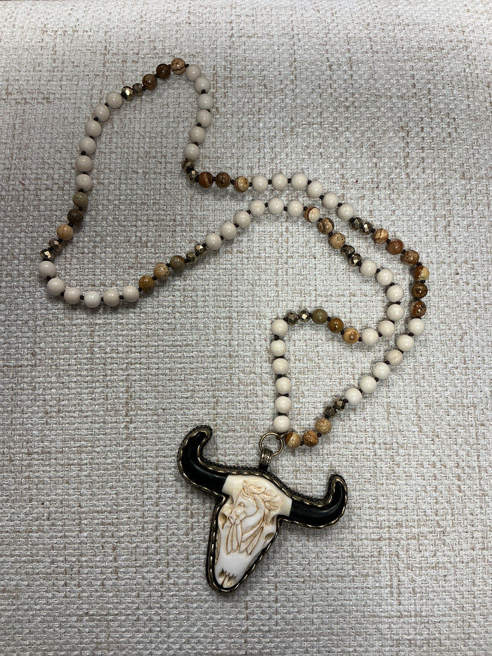 Beaded cow skull talisman necklace with colorful beads from American Unique Group, featuring a detailed cow skull pendant.