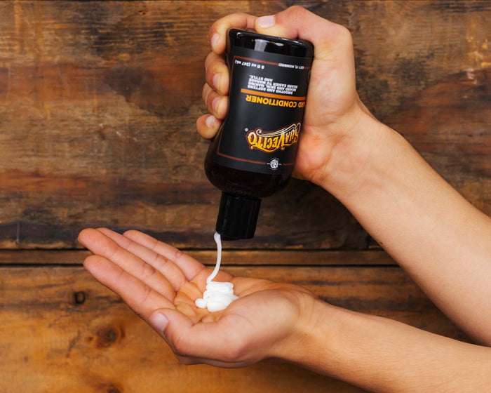 8 fl oz Beard Conditioner Being Squeezed into Palm