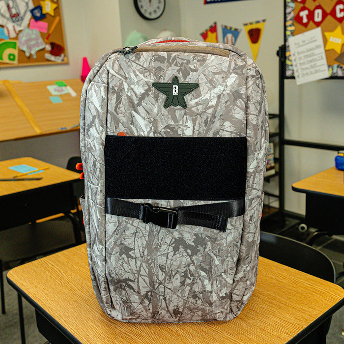 Multi-Color backpack with "Born To Fly SZN 2" design — back view