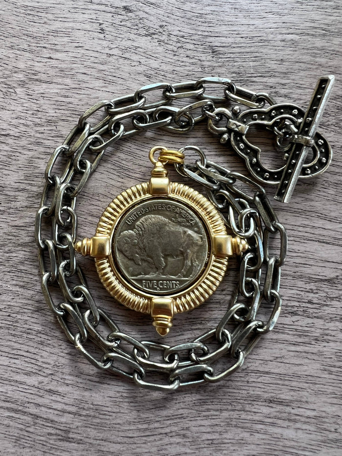 Chasing Cherubs Buffalo necklace featuring a detailed metallic buffalo pendant on a chain, stylish jewelry accessory.