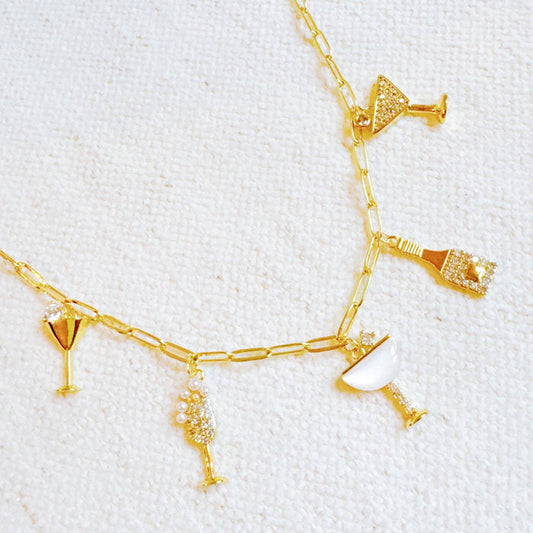 Ellison+Young Cheers To Happiness multi charm necklace with colorful charms on a delicate chain, stylish jewelry accessory.