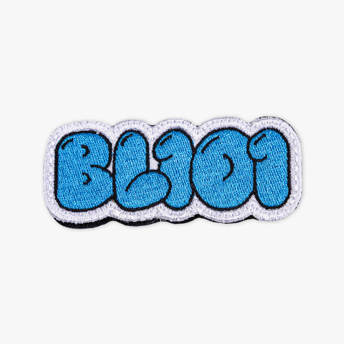 Adult model wearing blue patch with "Cotton Candy Blue Patch" design