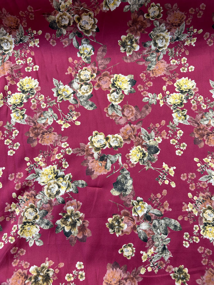 Cotton satin batiste is lightweight and very soft with a satin feel. It has a floral print with yellow roses on a burgundy background.