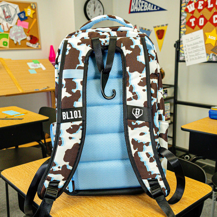 Multi-Color backpack with "Cowhide Curveball SZN 2" design — back view