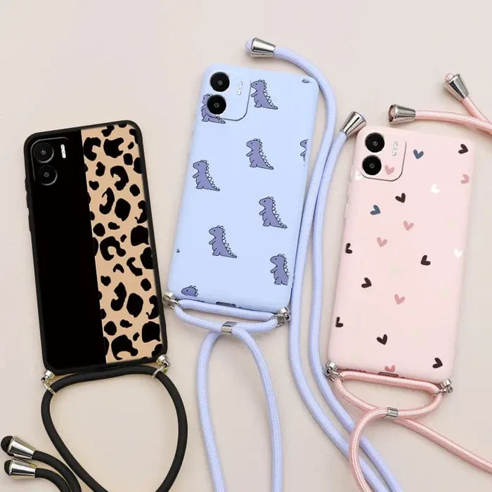 there are three cell phones with a strap and a phone case