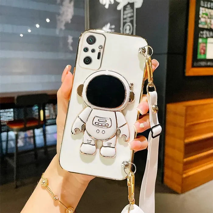 a woman holding a phone case with a cartoon character on it