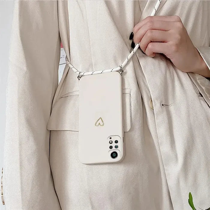 a woman holding a cell phone case