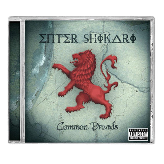 CD cover for Enter Shikaris Common Dreads album, showing a red lion on its hind legs before a faded map, with the band name in stylized text and a parental advisory label—includes standout tracks Solidarity and Juggernauts.