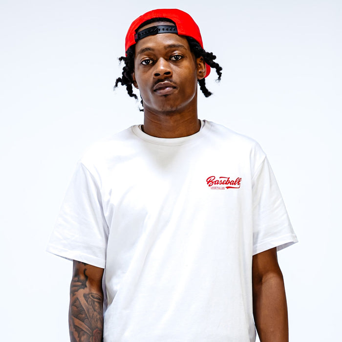 White t-shirt with red 'Baseball Lifestyle 101' text in the top corner on person