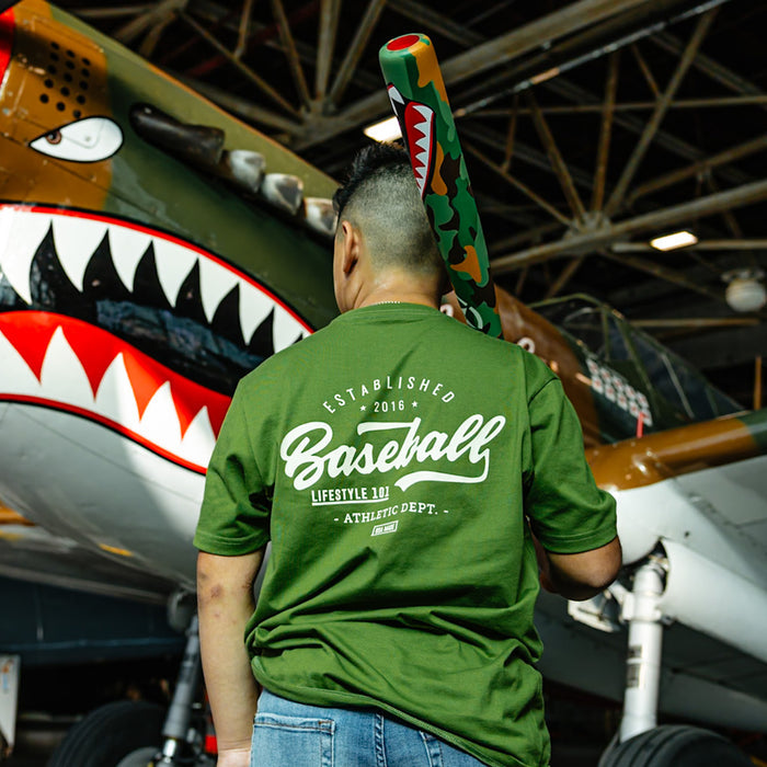 Olive green baseball graphic Youth T- Shirt with vintage white lettering that says 'Established 2016 Baseball Lifestyle 101 Athletic Dept. USA Made'.