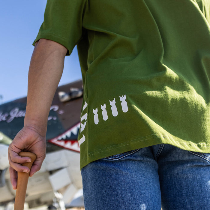 Adult model wearing field General Army Green graphic tee