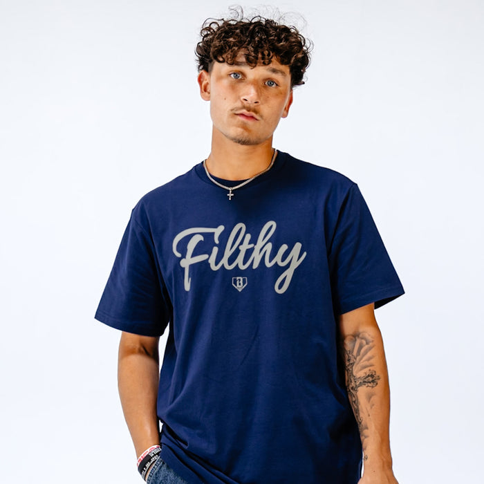 Person wearing a navy blue t-shirt with 'Filthy' printed on it against a white background