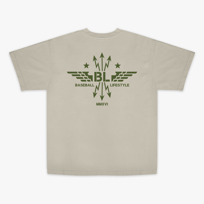 Tan t-shirt with dark green graphic featuring wings, arrows, and stars, with the Baseball Lifestyle BL logo in the center