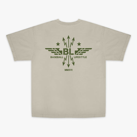 Tan t-shirt with dark green graphic featuring wings, arrows, and stars, with the Baseball Lifestyle BL logo in the center