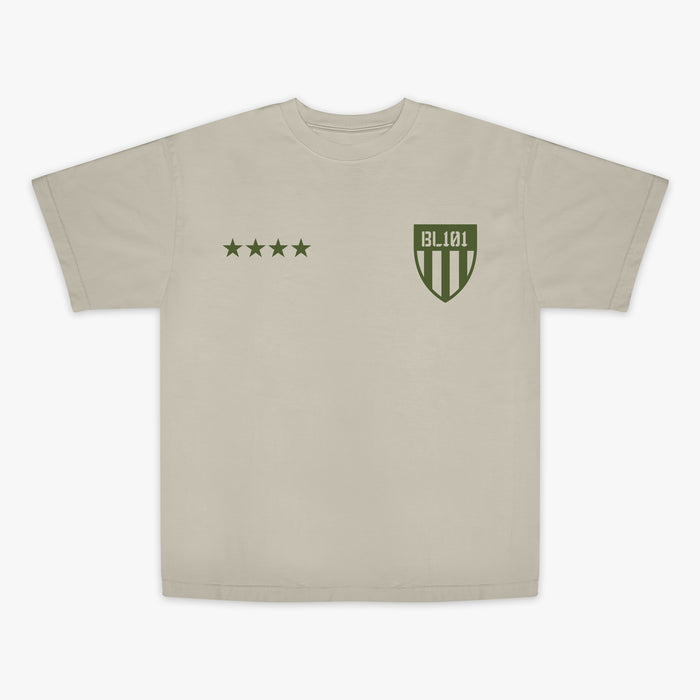 Tan t-shirt with dark green graphic with 4 stars and armor BL101 logo