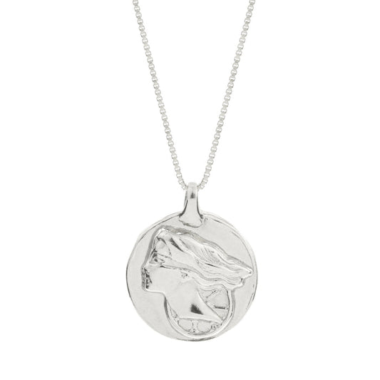 Silver pendant necklace with a round engraved medallion pendant on a bead chain