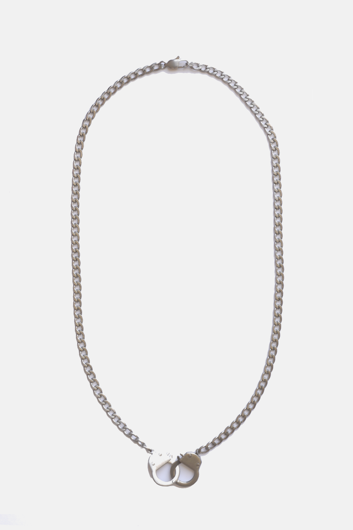 Curated Basics handcuff chain necklace featuring linked metal cuffs, stylish jewelry accessory for edgy fashion.