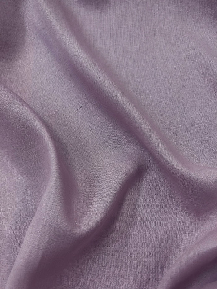 Close up of a dusty pink linen fabric.