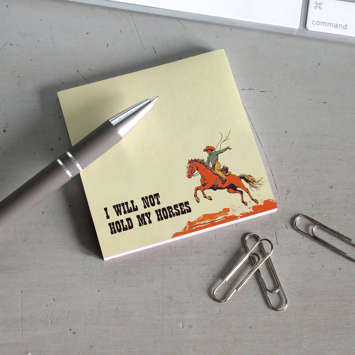 Sticky note pad from Bad Betty Greeting Co. featuring humorous "I Will Not Hold My Horses" design, with yellow notes and playful text.