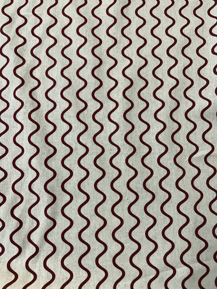 Wavy red stripe pattern on a beige background.