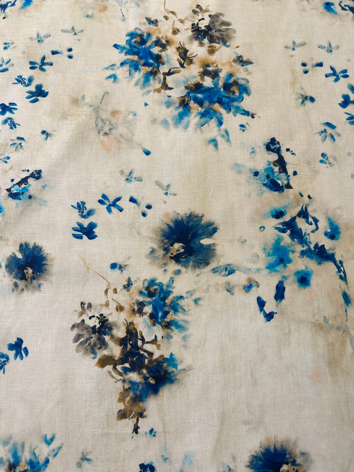A vibrant print of splashes of blue watercolor florals.