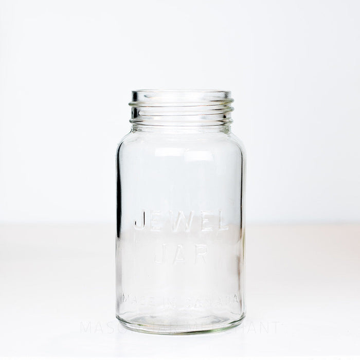Vintage gem mouth quart mason jar with Jewel Jar logo, on a white background