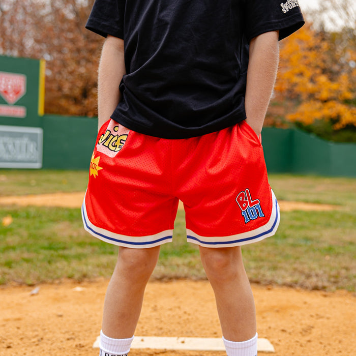 Person wearing red shorts with BL101 logo on it
