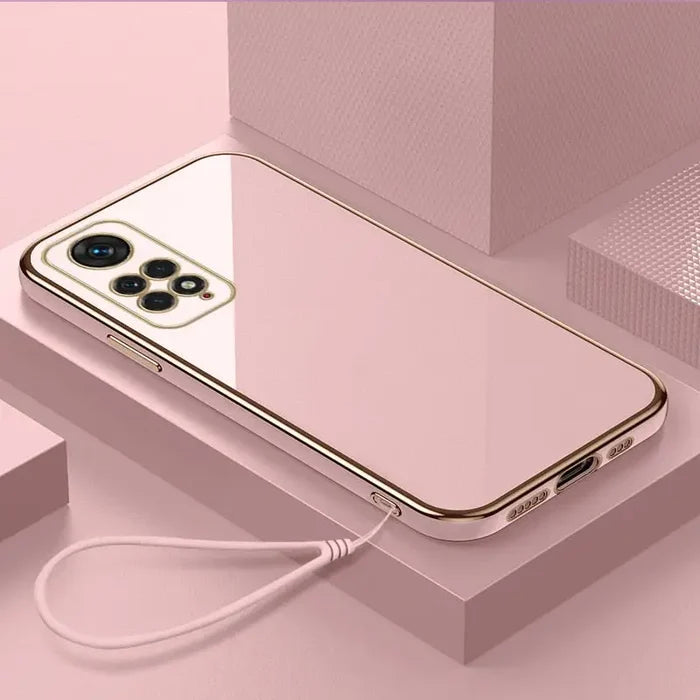 a white iphone with a gold case and earphones