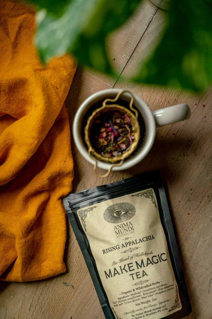 Tea cup with tea bag and package on a wooden surface