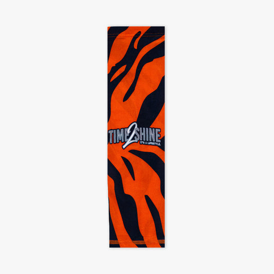 Orange and black zebra-striped towel with 'Time Shine' logo on a white background