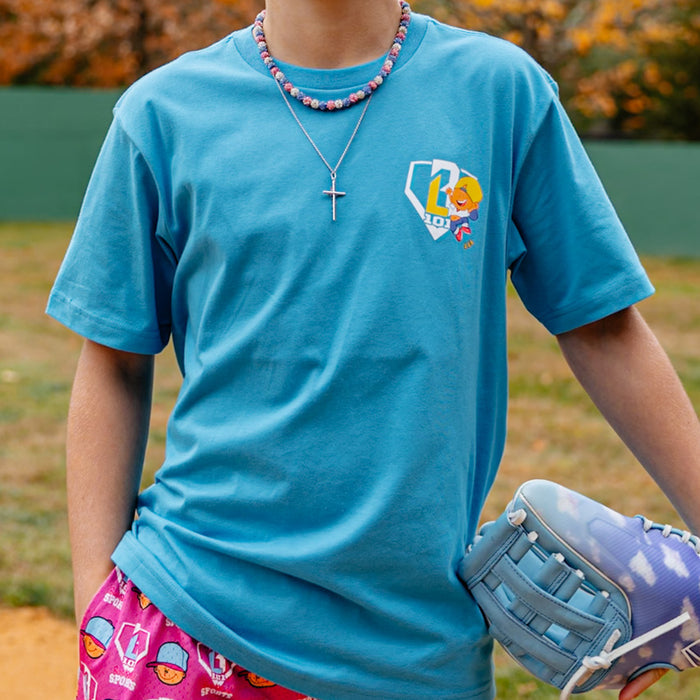 Adult model wearing blue graphic tee with “Pablo Power” design