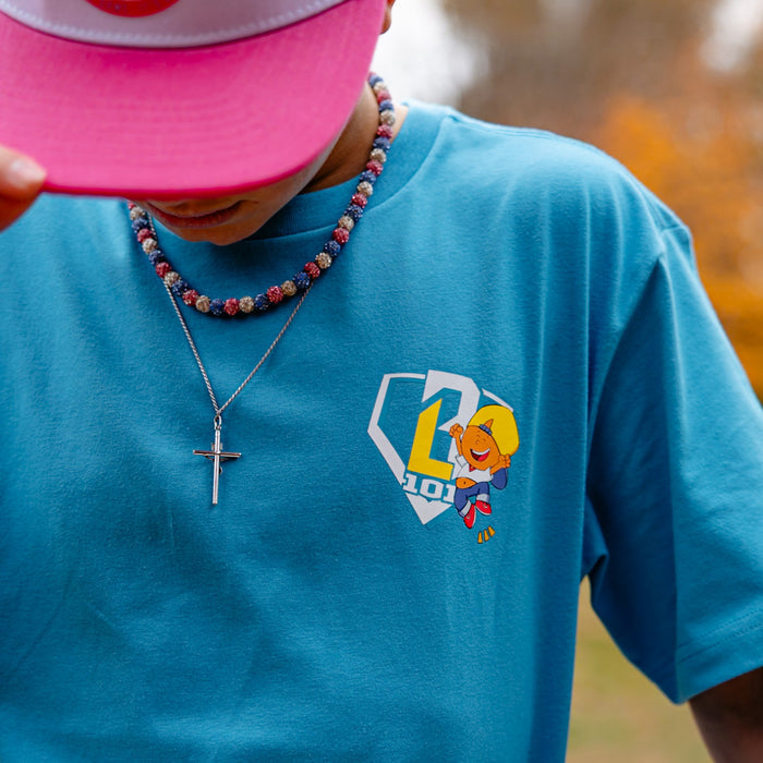 Adult model wearing blue graphic tee with “Pablo Power” design