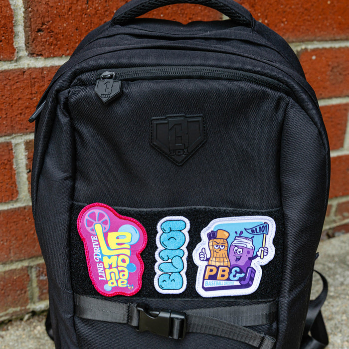Adult model wearing multi-color patch with "PB & J Patch" design