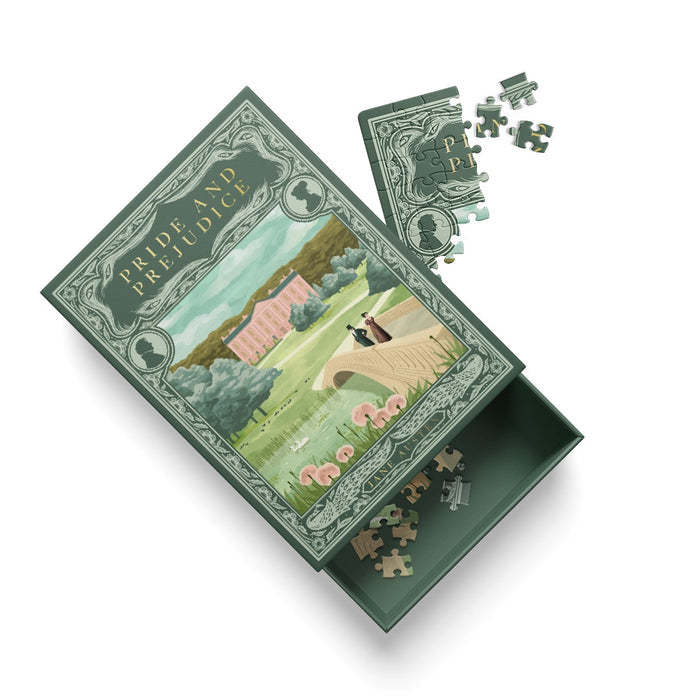 The Ohh Deer Pride and Prejudice | 99 Piece Jigsaw Puzzle makes a charming addition to any coffee table, featuring an open box that displays a scenic illustration by Andrew Kolb with partially assembled pieces both inside and beside the lid.